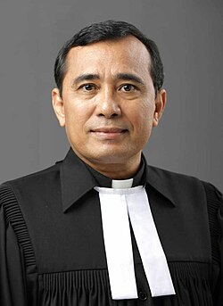 An Ephorus of the Batak Christian Protestant Church in Indonesia, one of the largest Lutheran churches in Southeast Asia, wearing white bands and Geneva gown