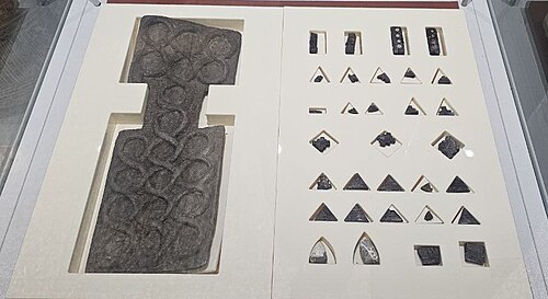 The complete set of the Shahr-i Sokhta board game, Iran, with 27 pieces and 4 dice in its current condition, about c. 2600 BC – c. 2400 BC National Museum of Iran