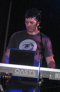James Ash playing the keyboard, performing for Rogue Traders