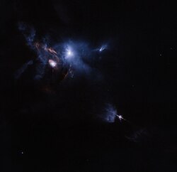 A broader view of the Taurus Molecular Cloud region. HL Tauri is shrouded in the bright blue region at upper center-left.