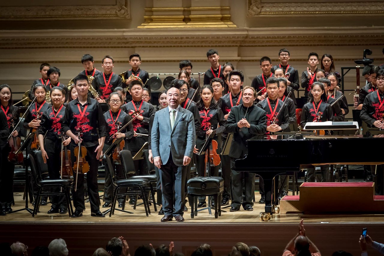 Zhou Long with NYO-China and Ludovic Morlot at Carnegie Hall.jpg