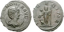 coin of Zenobia. the obverse depicting the head of a woman wearing a crown. the reverse depicts a goddess. inscriptions on both sides