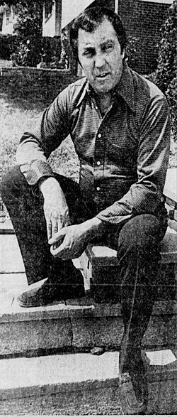 A man sitting on steps.