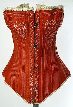Highly decorative English corset from the 1880s with contrasting embroidery and lace trim