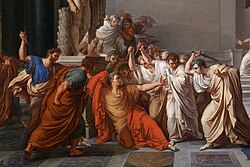 Man in red and yellow being stabbed by men in white, with a man in green and man in blue joining in. People scattered on the outside of the stabbing are shown shocked