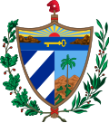 A shield in front of a Fasces crowned by the Phrygian Cap, all supported by an oak branch and a laurel wreath