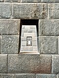 Original trapezoid windows inside the temple