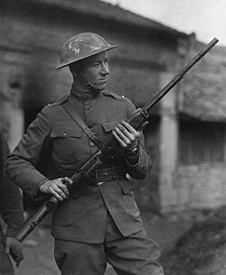 Portrait photograph of 2nd Lt. Val A. Browning holding a Browning Automatic Rifle while in France.