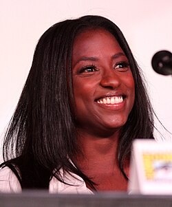 Rutina Wesley smiling on a panel at Comic-Con.