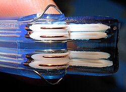 Cut-open SATA cable showing the two foil shielded differential pairs
