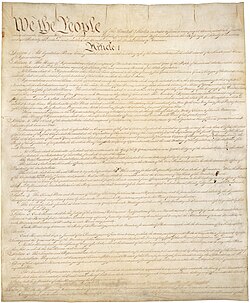 Image of faded handwritten copy of the US Constitution
