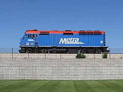 Blue locomotive on raised track