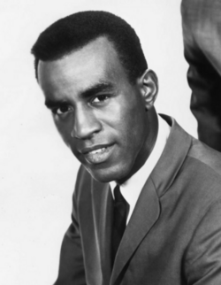 A singer wearing a suit