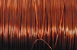 Copper bars stacked in an LME-approved warehouse, symbolizing global copper trading and storage.