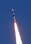 PSLV Mid-flight with a visible vapor cone or shock collar formed around payload fairing