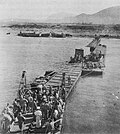 1006th Seabees using a Three-Section Pontoon Causeway at Safta Beach in September 1943.