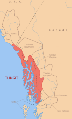 Map showing the traditional territory of the Tlingit people along the Pacific coast of southeastern Alaska and adjacent coastal British Columbia, highlighted in red, with neighboring Indigenous language groups labeled inland and to the south.