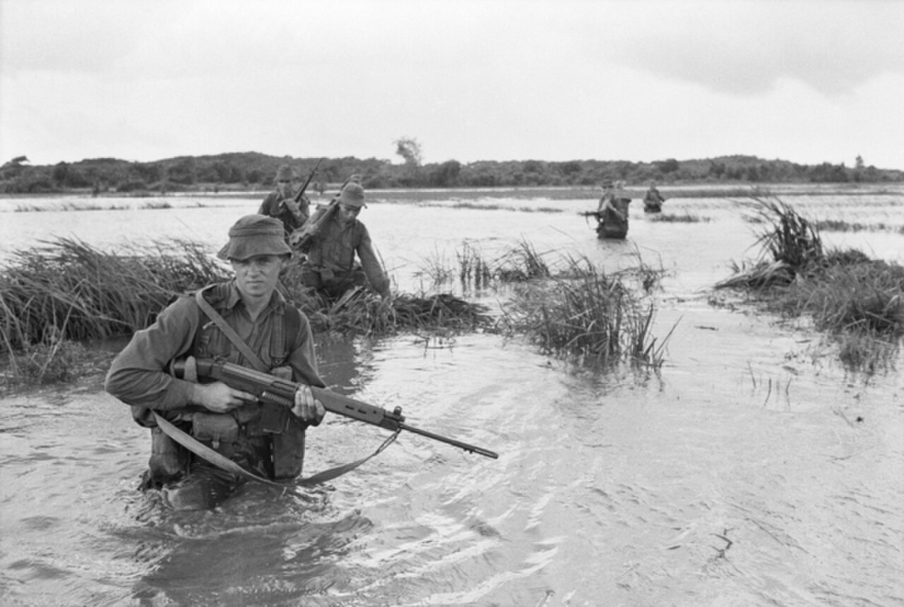 Members of 2 RAR wading through water during a patrol in September 1967.jpg