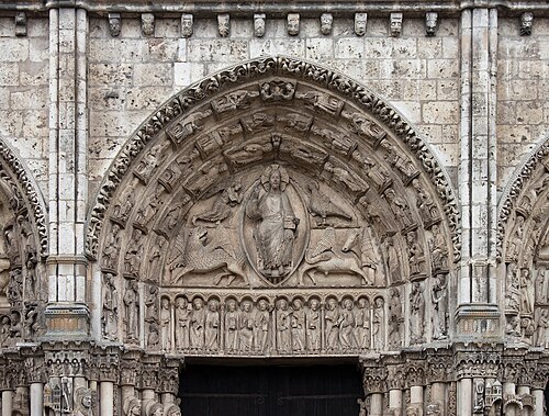 Central tympanum of the Royal Portal. Christ seated on a throne, surrounded by the symbols of the Evangelists; a winged man for St. Matthew, a lion for St. Mark; a bull for St. Luke; and an eagle for St. John.