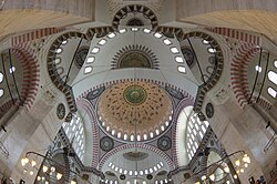 The Süleymaniye Mosque (1550–7), evokes the Hagia Sophia's design with a central dome and two semi-domes.[102]