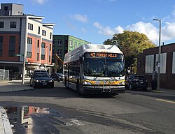 An MBTA bus in the area of Nubian Square in 2019