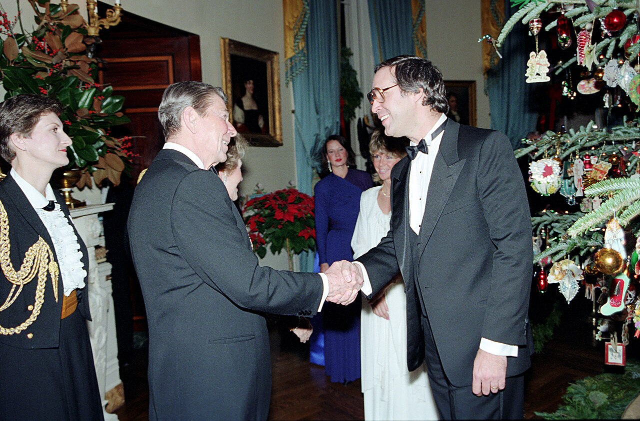 President Ronald Reagan Greeting Comedian Checy Chase at a Reception in Honor of The 1985 Kennedy Center Honorees in The Blue Room - DPLA - 677129f6b518367d70c925ea7d2012da.jpg
