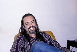 Root Boy Slim relaxing in his Takoma Park, Maryland home in 1980
