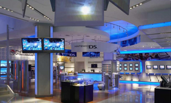 Interior view of a building with kiosks and merchandise running alongside its walls.