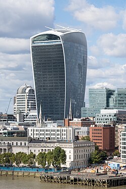 Skyscraper with a flared, top‑heavy form