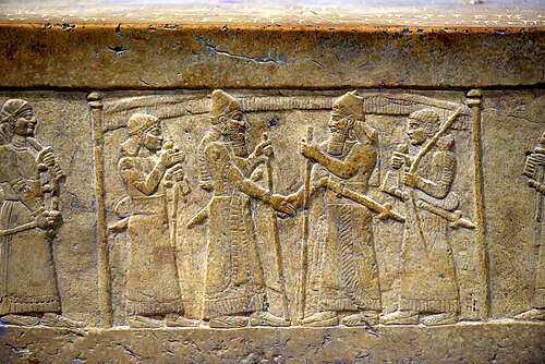 Assyrian king Shalmaneser III (right) shakes the hand of Babylonian king Marduk-zakir-shumi I (left), 9th century BCE