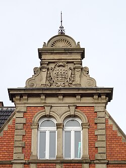 Gable of Neckarau town hall with the coat of arms