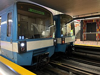 Two MR-73 trains side by side on parallel tracks at Guy–Concordia station platform