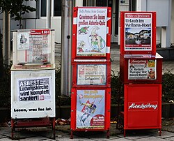 In Munich, Germany, the dispensers for the three local tabloids (depicted) have only transparent plastic lids on top which can be readily opened without inserting a coin - which is, however, demanded. Hence, the sellers have a significant amount of trust in people.