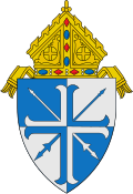 The arms of the Diocese of Lansing: The lances crossed per saltire are a play on the name of the see, the city of Lansing, Michigan.[7]
