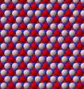 View of trioctahedral sheet structure of mica. The binding sites for apical oxygen are shown as white spheres.