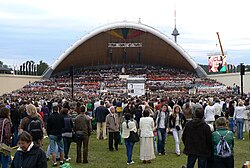 An outdoor stage and a crowd