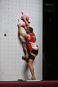 Start position. The climber stands on a pressure plate foot trigger, which is used for detecting false starts.