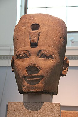 A osiride stone head from Karnak, most likely depicting Thutmose I, on display at the British Museum
