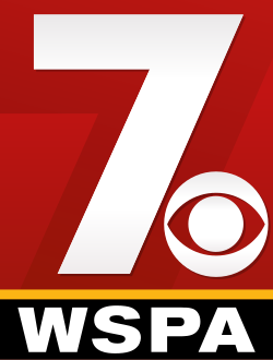 A large red rectangle with a yellow-orange border on the bottom, inside the rectangle is a large numerical 7 with the CBS eye logo at the bottom right, both in white; underneath the yellow-orange border is a black box with "WSPA" in a white serif font.