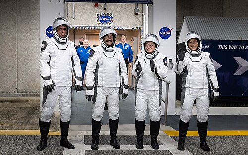 Crew-12 astronauts outside the O&C Building