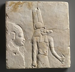 Plaque with head and shoulders of a priestly figure and Sobek; 400–30 BCE; limestone; height: 27.5 cm, width: 25.5 cm; Metropolitan Museum of Art (New York City)