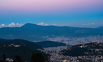 Nagarjun municipality with Tarakeshwar and Budhanilkantha in background.