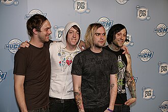 Four guys standing together