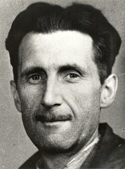 Head shot of a middle-aged Orwell, with dark hair and a slim mustache