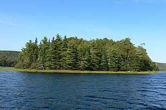 Small wooded Starr Island surrounded by the waters of Blacketts Lake