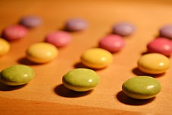Sweets sorted by colour and aligned in rows and columns