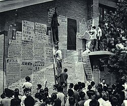 College students hang political posters during Culture Revolution