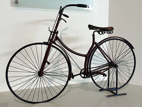 1886 Rover safety bicycle at the British Motor Museum. The first modern bicycle, it had a rear-wheel-drive and was chain-driven with two similar-sized wheels. Dunlop's pneumatic tire was added to the bicycle in 1888.