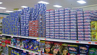 Small cans on grocery shelves