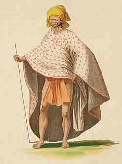 A Tahitian man wearing a shawl and a head wrap